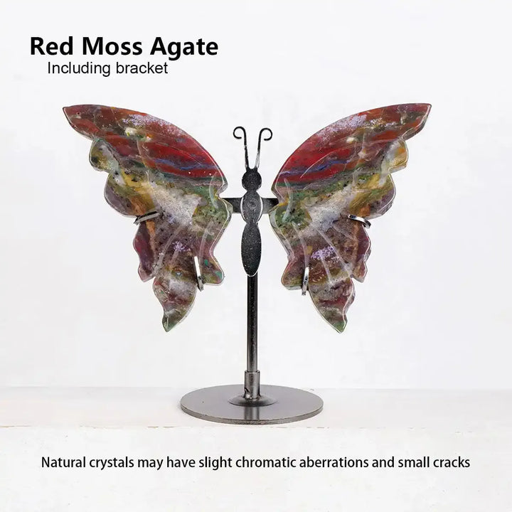 Red Moss Agate crystal carved butterfly on a metal stand, featuring vibrant red and green patterns for grounding energy.