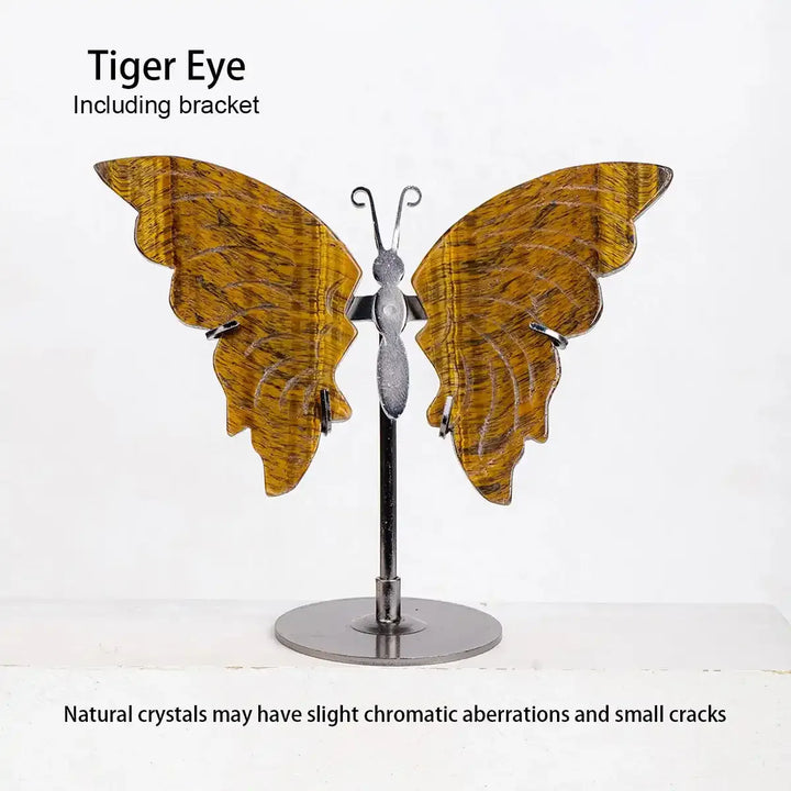 Tiger Eye crystal carved butterfly with golden chatoyancy, displayed on a sleek metal stand for elegant home decor.