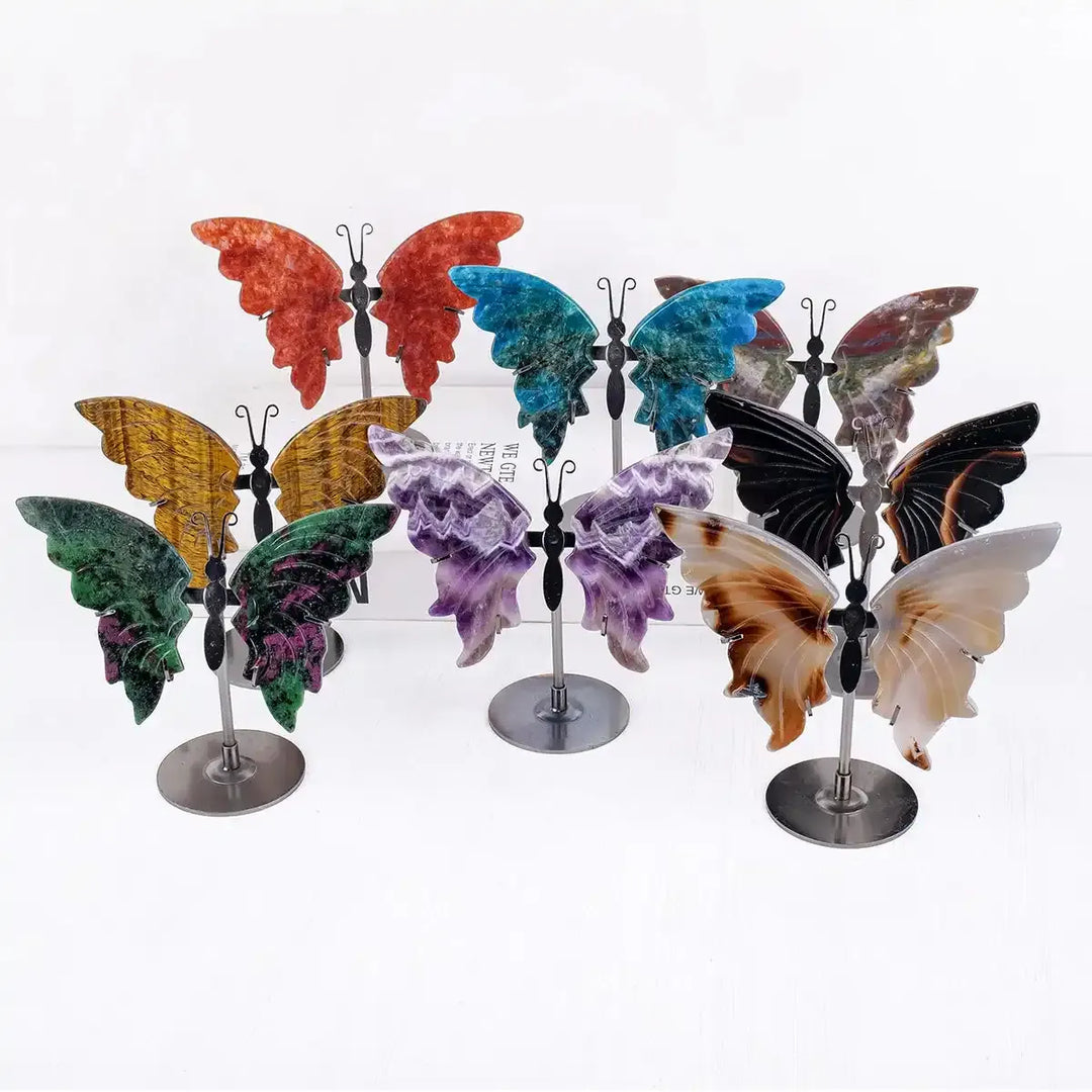 Crystal Carved Butterfly collection in assorted gemstones, featuring elegant wings on metal stands for mindful decor.