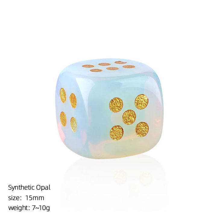 15mm Opal crystal carved dice with rounded corners, featuring a smooth iridescent finish and shimmering gold pips.