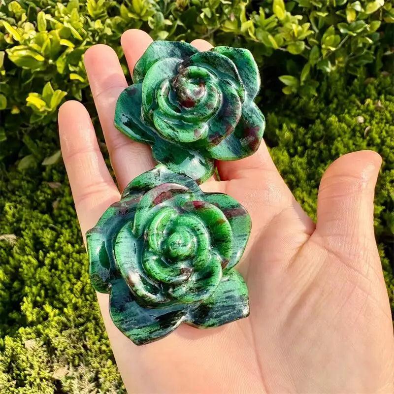 Handheld Ruby in Zoisite flower figurine, a crystal carving for Heart Chakra healing with deep green and red tones.