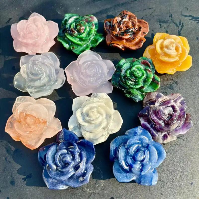 Collection of delicate flower figurines carved from genuine healing crystals like rose quartz, amethyst, and blue aventurine.