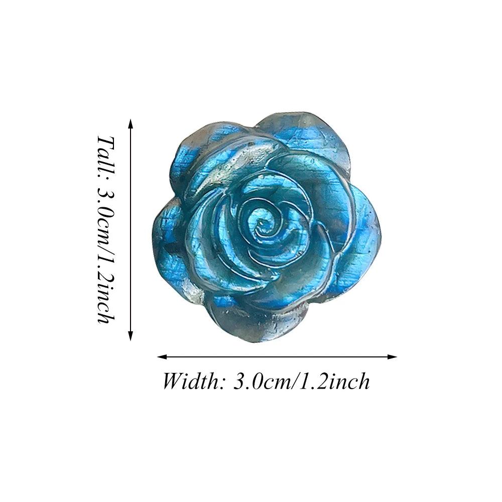 Iridescent blue Labradorite crystal carved into a delicate rose, radiating growth and transformation.