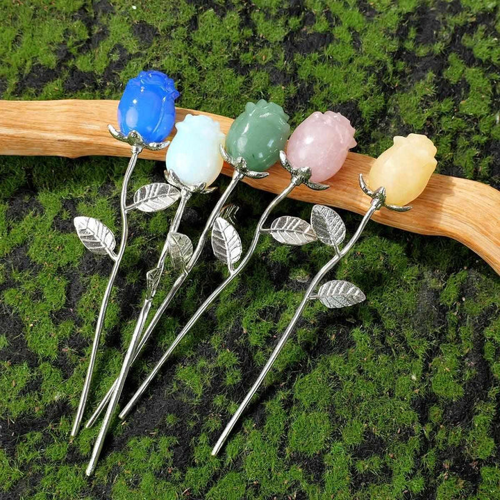 Crystal carved rose flowers in assorted gemstones with silver stems, perfect for healing, meditation, and altar decor.