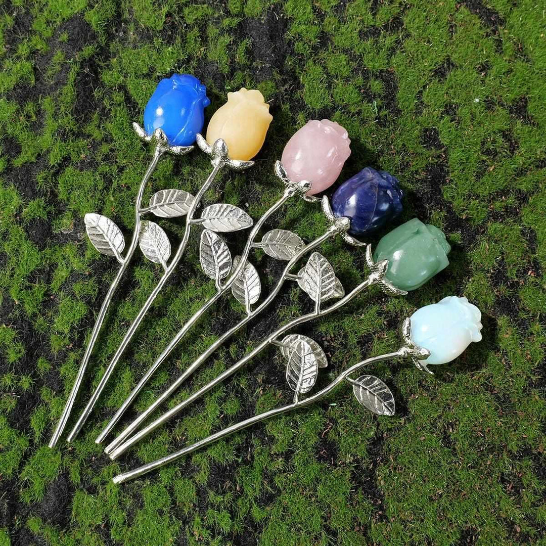Crystal carved rose flowers in assorted gemstones with silver stems, perfect for meditation and altar decor.