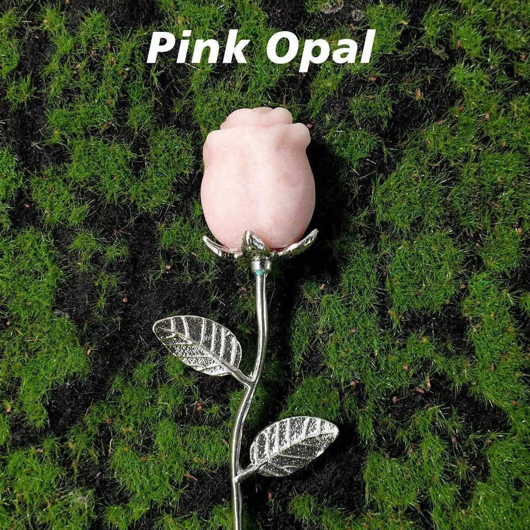 Pink Opal crystal carved rose flower with detailed petals on a silver stem, a beautiful, lasting gemstone gift.