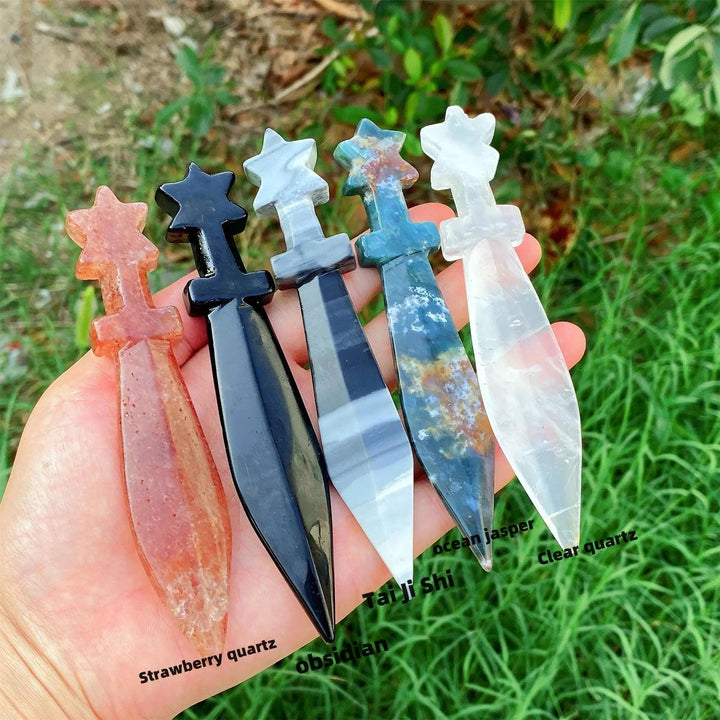 Hand-carved crystal sword letter openers: Strawberry Quartz, Obsidian, Tai Chi Stone, Ocean Jasper, Clear Quartz.