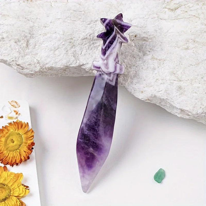 Hand-carved Dream Amethyst Crystal Carved Sword Letter Opener with purple hues and a star-shaped hilt.