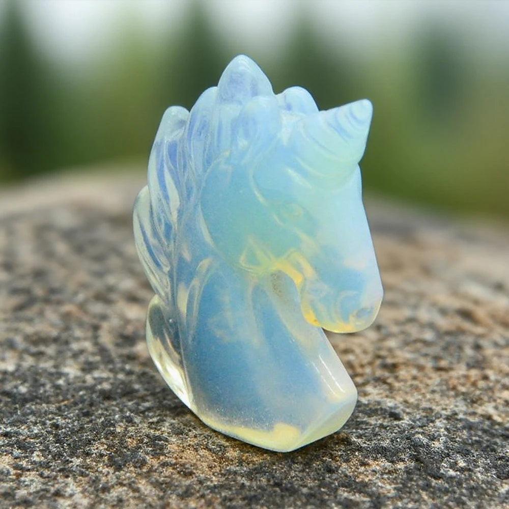 51mm hand-carved opalite crystal unicorn figurine with a glowing, iridescent finish for healing and peace.