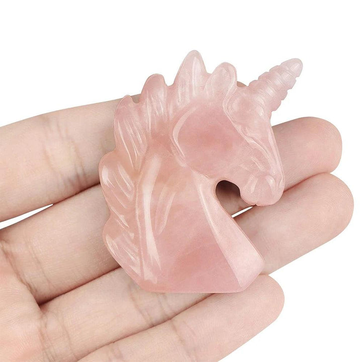 Hand-carved 51mm Rose Quartz unicorn figurine, a heart-chakra crystal statue for love, healing, and peaceful energy.