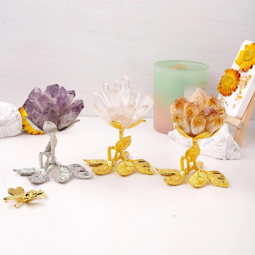 Three raw crystal cluster flower trees: Amethyst, Clear Quartz, and Citrine, on elegant gold and silver stands.