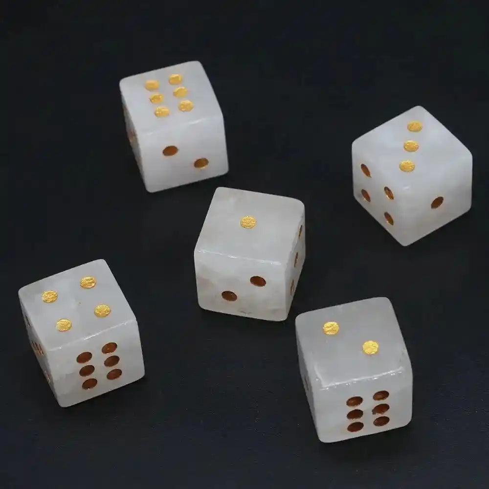 Five 16mm hand-carved Clear Quartz Crystal Dice with gold-painted pips, perfect for gaming or divination.