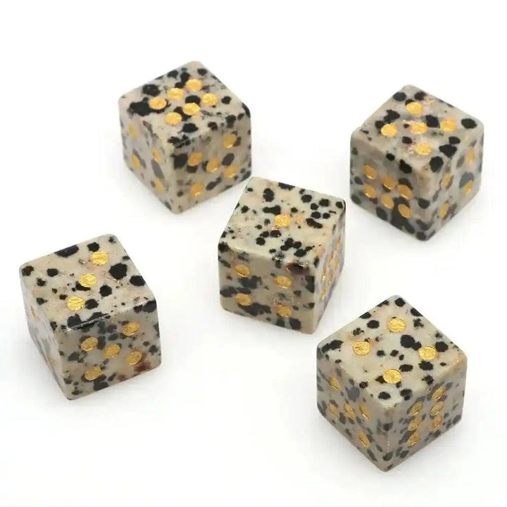 Five 16mm hand-carved Dalmatian Jasper Crystal Dice with gold-painted pips, perfect for gaming or divination.