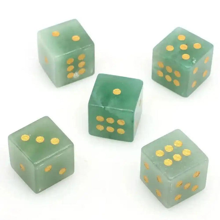 Five hand-carved Green Aventurine Crystal Dice with gold pips, perfect for gaming or divination.