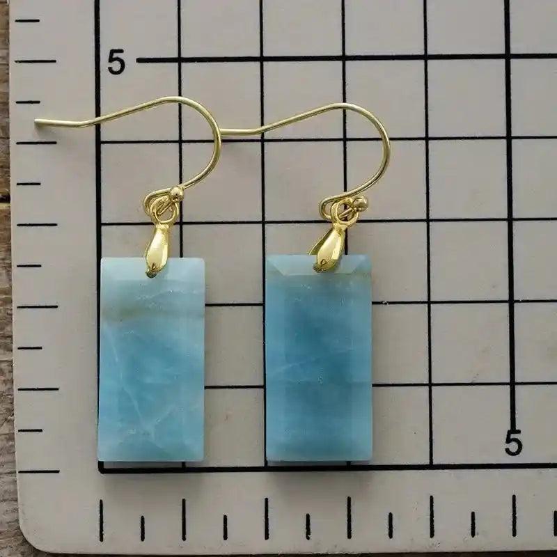 Boho Gemstone Drop Earrings with rectangular blue Larimar stones and gold-plated hooks, offering calm and clarity.