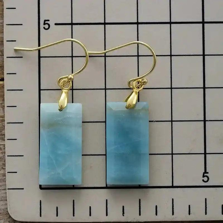 Boho Gemstone Drop Earrings with rectangular blue Larimar stones and gold-plated hooks, offering calm and clarity.