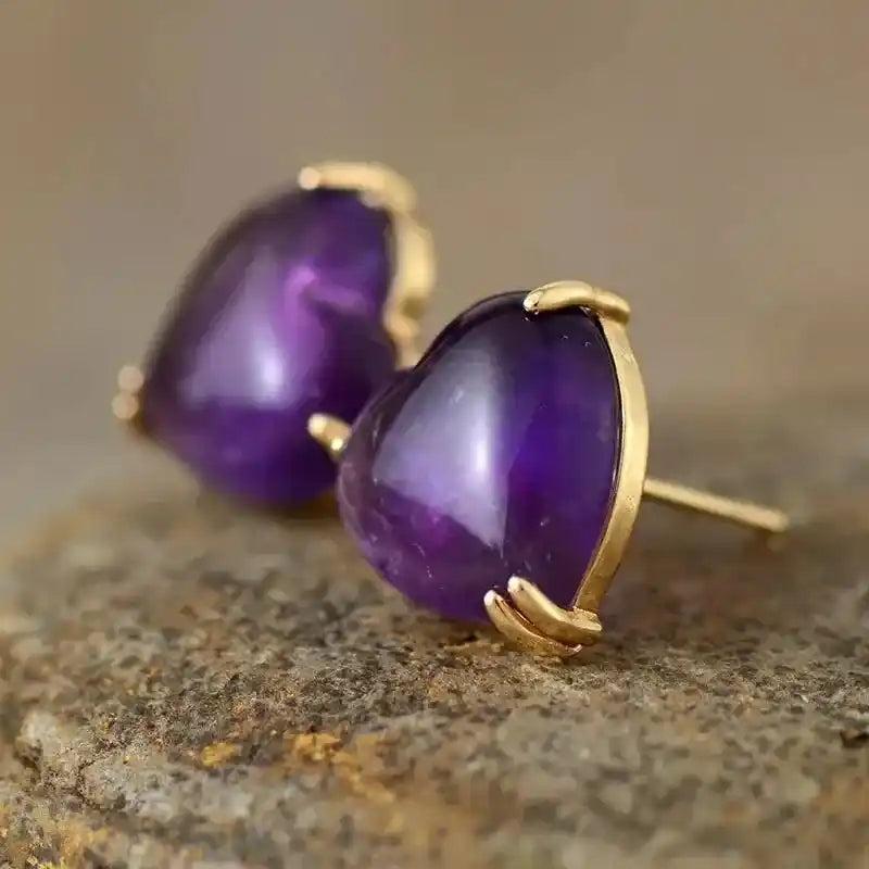 Radiant Heart-Shaped Amethyst Stud Earrings, promoting calm and clarity, set in polished gold.