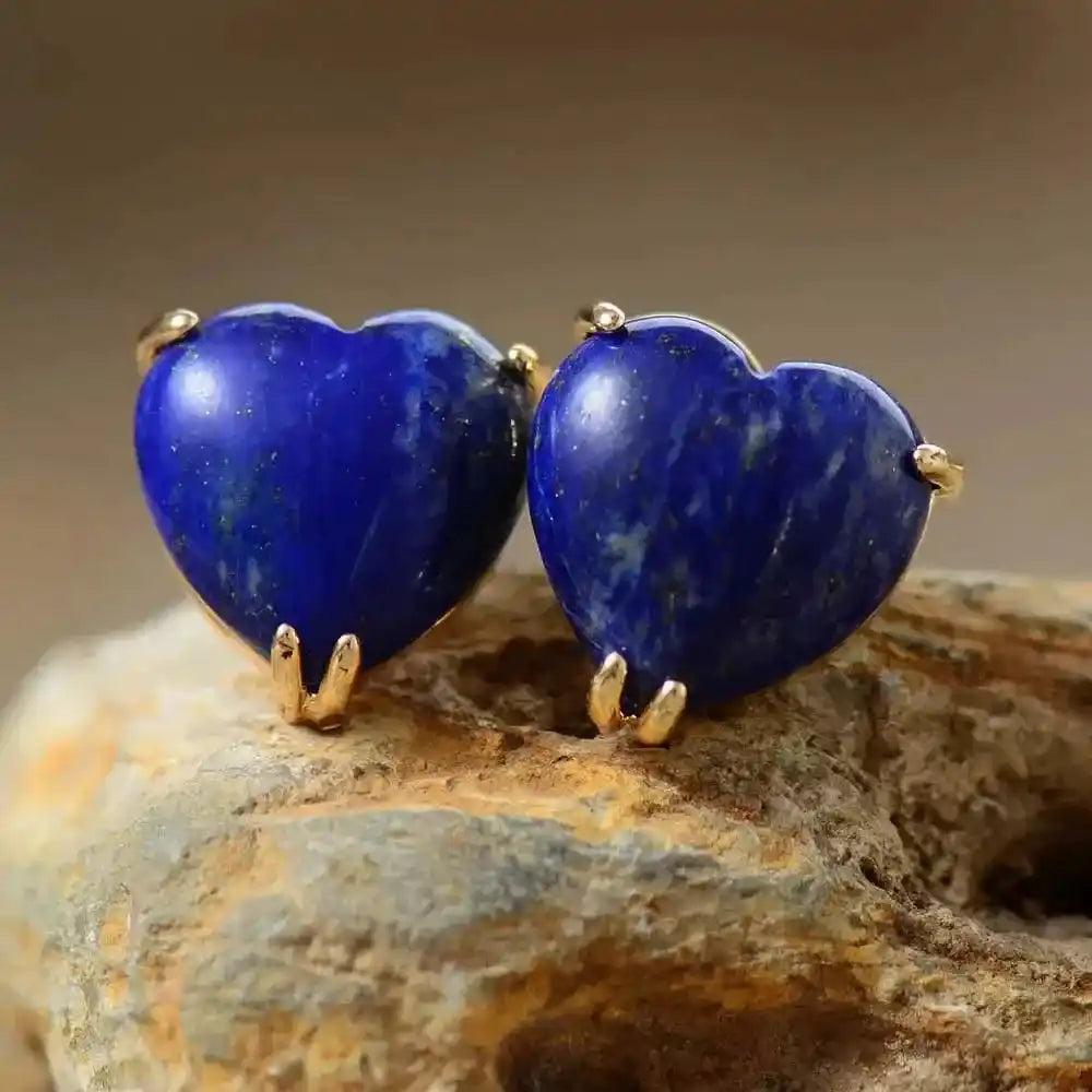Heart-Shaped Lapis Lazuli Gemstone Stud Earrings, deep blue with gold settings, enhancing wisdom and truth.