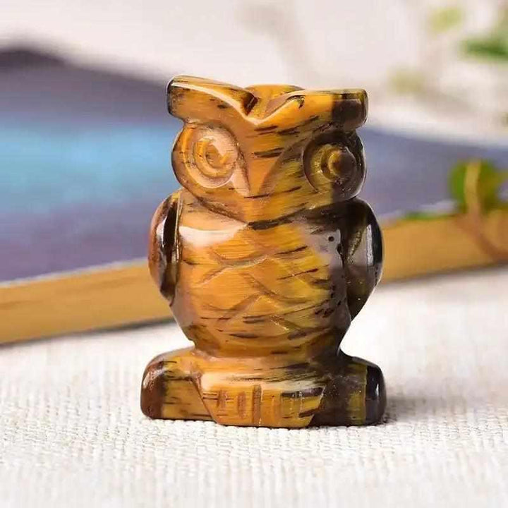 Hand-carved tiger's eye crystal owl figurine, a 40mm polished stone symbol of courage and wisdom for your desk or altar.