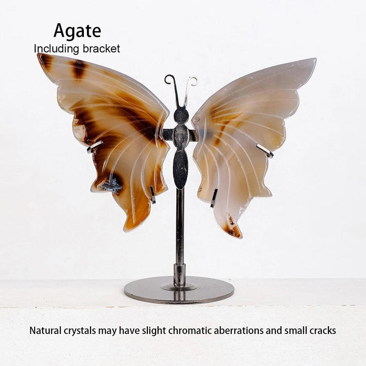 Polished Agate crystal butterfly wings, displaying natural brown and white bands on a dark metal stand.