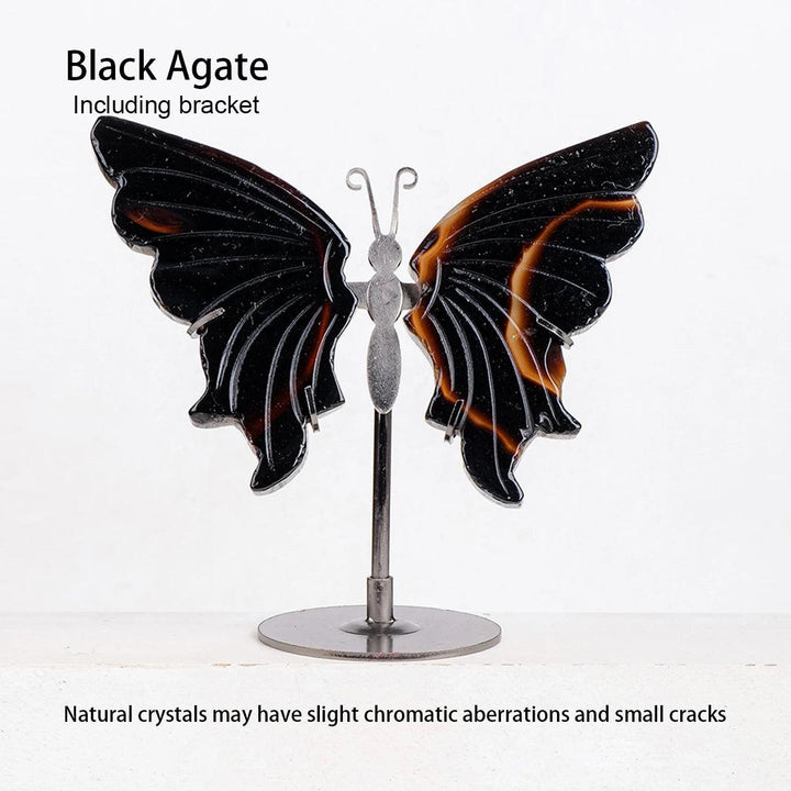 Polished Black Agate crystal butterfly wings with orange veins on a silver stand, symbolizing transformation.