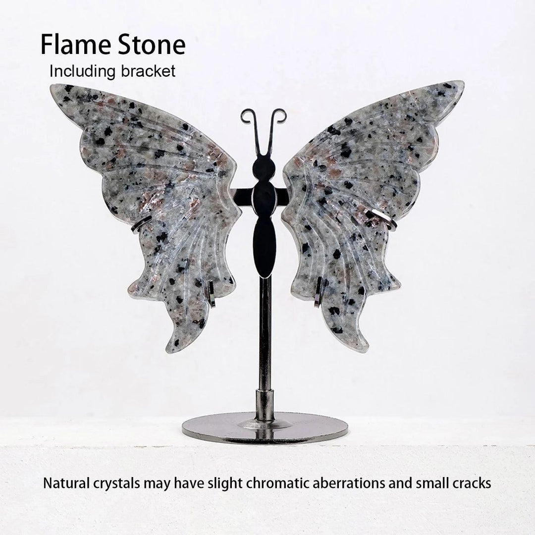Polished Flame Stone crystal butterfly wings with black speckles, displayed on a sleek black metal stand.