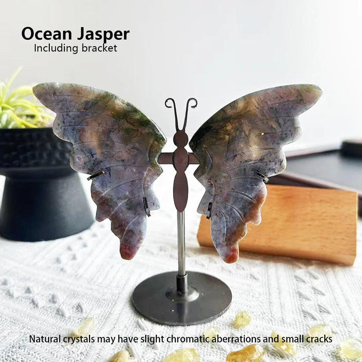 Polished Ocean Jasper butterfly wings on a metal stand, showcasing natural blue, green, and brown swirls.