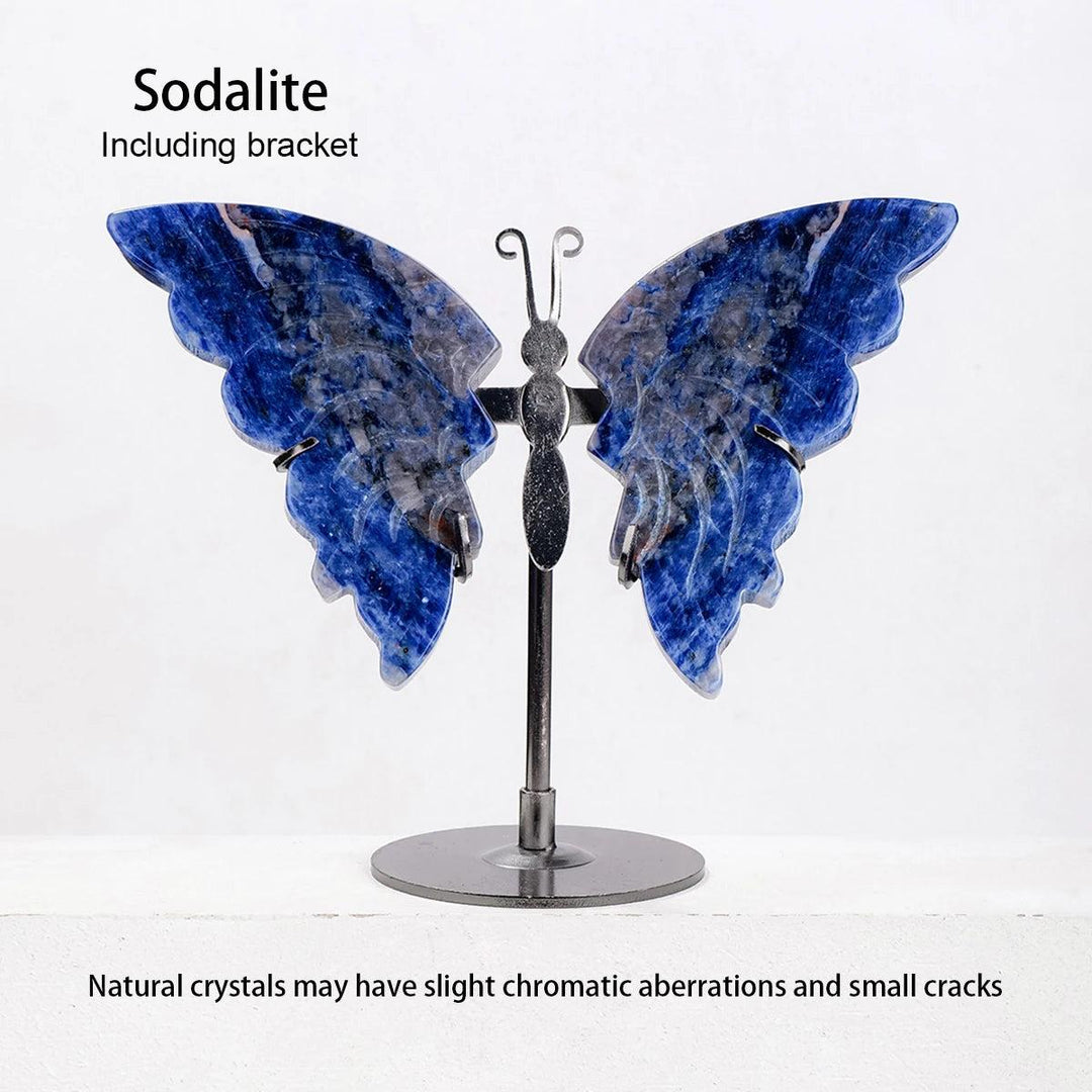 Polished Sodalite crystal butterfly wings with white veining, displayed on a silver metal stand.