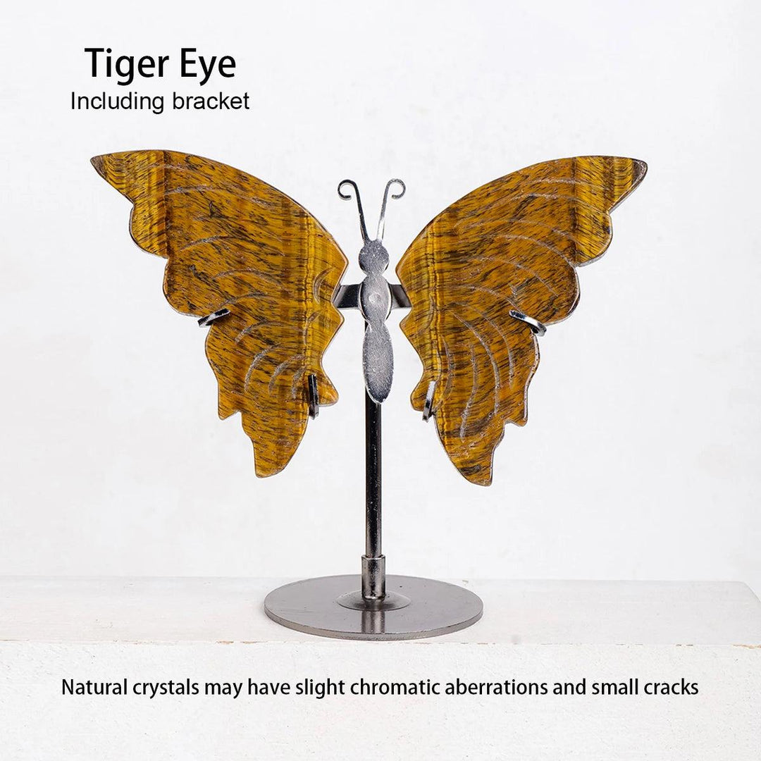 Polished Tiger Eye crystal butterfly wings on a silver metal stand, showcasing golden-brown stripes for growth and transformation.