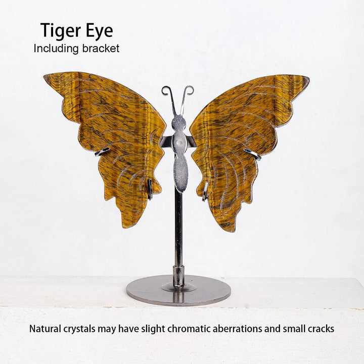 Polished Tiger Eye crystal butterfly wings on a silver metal stand, showcasing golden-brown stripes for growth and transformation.