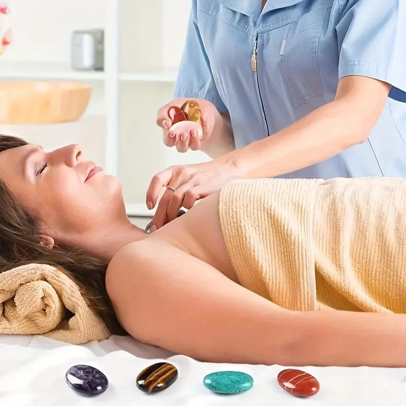 Smooth, colorful natural crystal palm stones used in a relaxing spa massage therapy session.