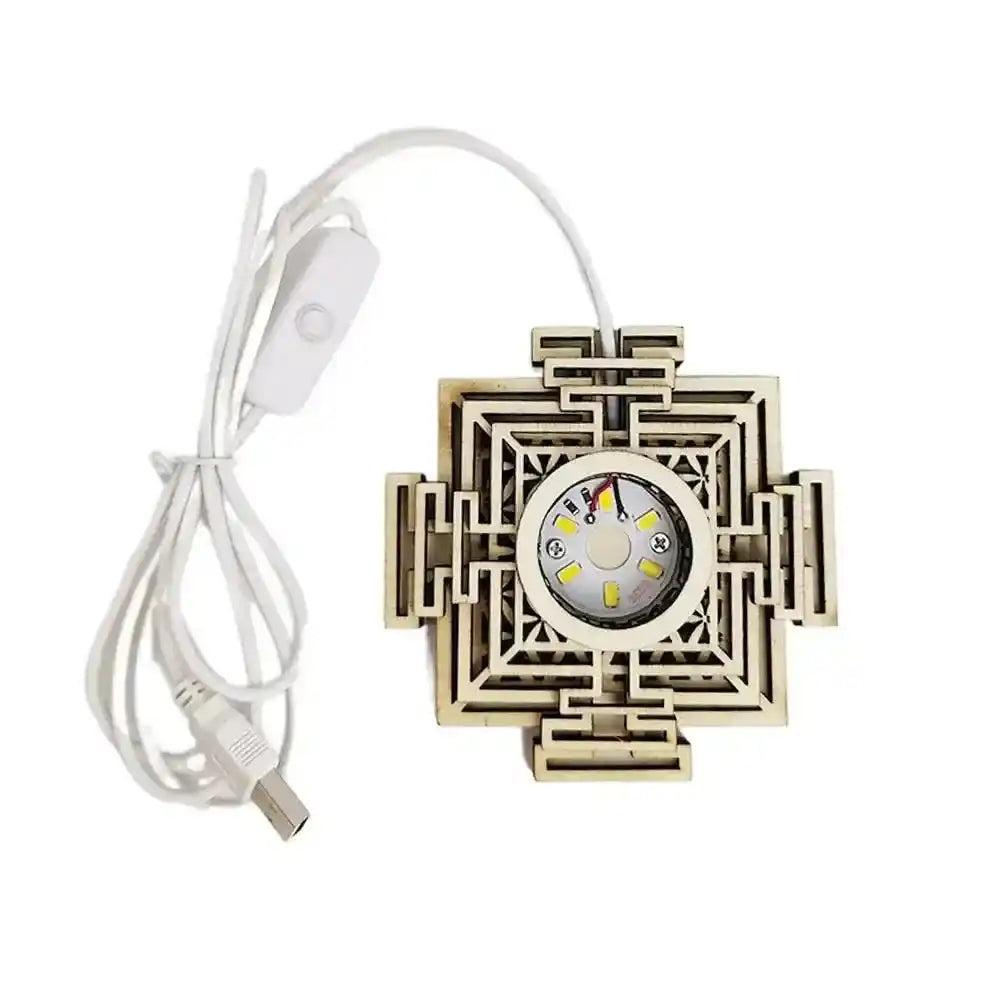 Elegant wooden mandala LED light stand with USB cable, perfect for illuminating crystal spheres.