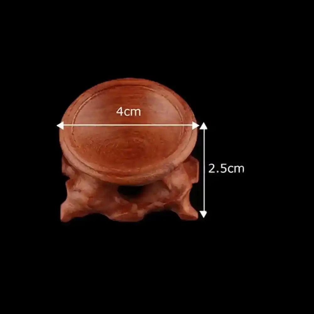 Elegant 4cm diameter, 2.5cm tall carved dark wood Crystal Sphere Display Stand, showcasing natural beauty.