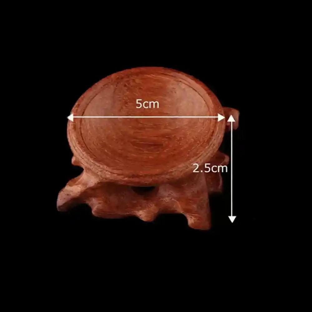 Elegant 5cm wide, 2.5cm tall carved brown wood crystal sphere display stand. Perfect for showcasing gemstones.