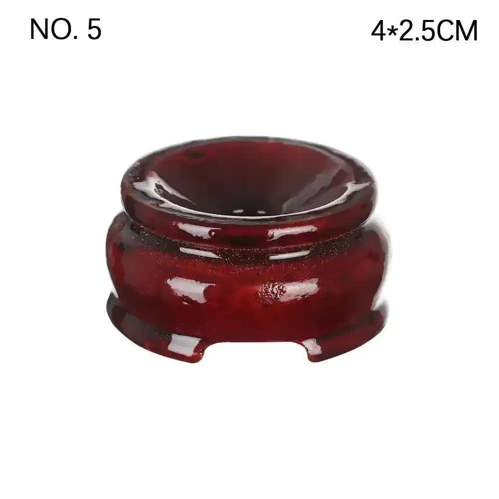 Elegant dark brown wooden crystal sphere display stand, 4x2.5cm, perfect for showcasing gemstones.