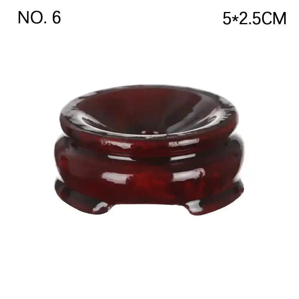 Elegant dark red wooden crystal sphere display stand, 5x2.5cm, perfect for showcasing gemstones and enhancing décor.