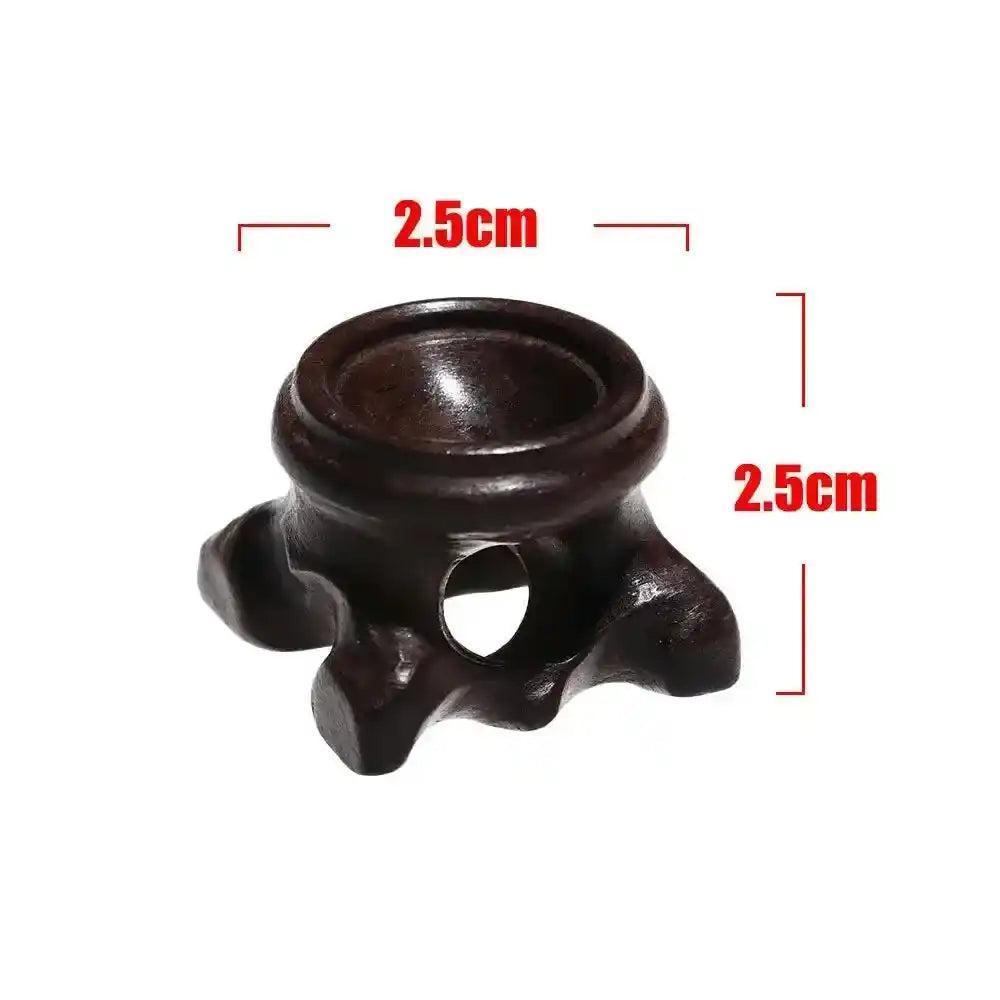 Dark brown wooden crystal sphere display stand, 2.5cm, showcasing elegant craftsmanship for gemstones and stones.