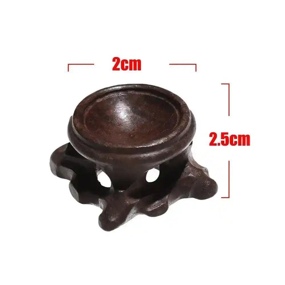 Dark brown wooden display stand for crystal spheres, 2cm diameter, 2.5cm tall, with elegant carved base.