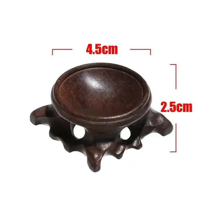 Elegant dark wood crystal sphere display stand, 4.5cm wide, 2.5cm tall, for showcasing gemstones.