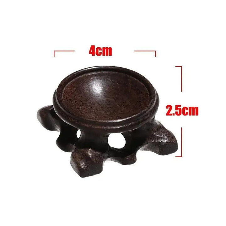 Dark brown wooden crystal sphere display stand, 4cm wide, 2.5cm tall, for elegant gemstone showcasing.