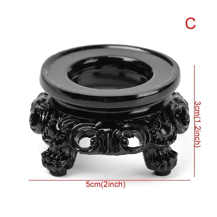 Elegant black carved wood crystal sphere display stand, 5cm wide, showcasing intricate details for your gemstones.