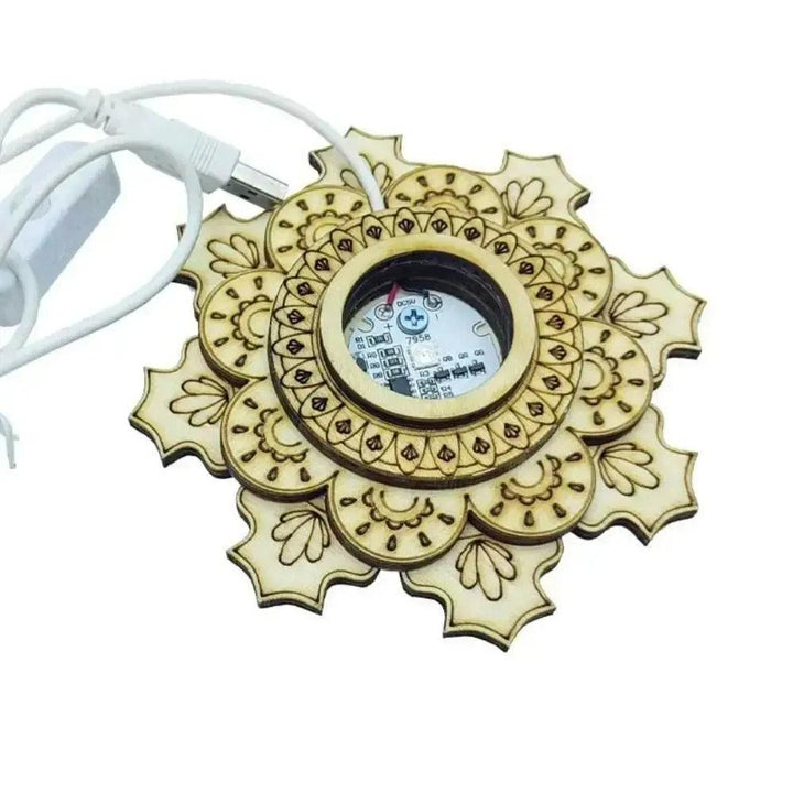 Elegant wooden mandala display stand with intricate carvings, a central LED light, and a white USB power cord.