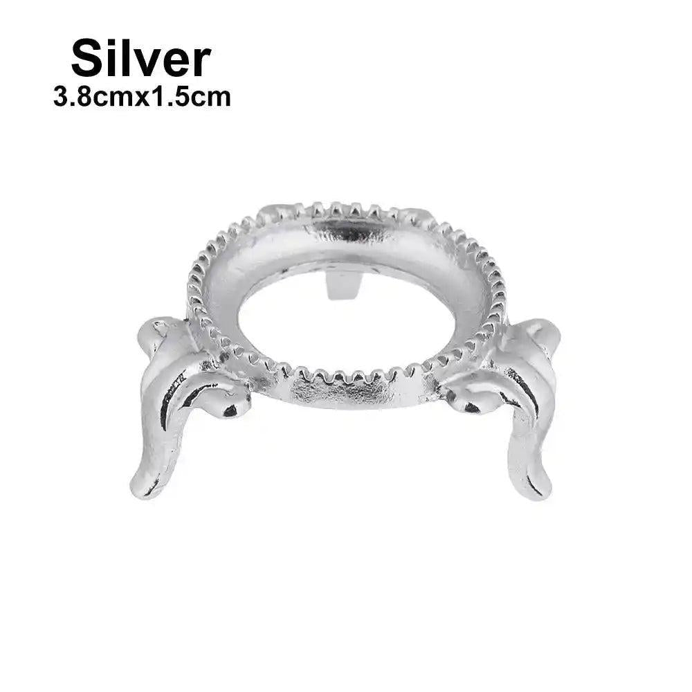 Elegant silver metal display stand for crystal spheres, 3.8cmx1.5cm, featuring ornate legs and a decorative rim.