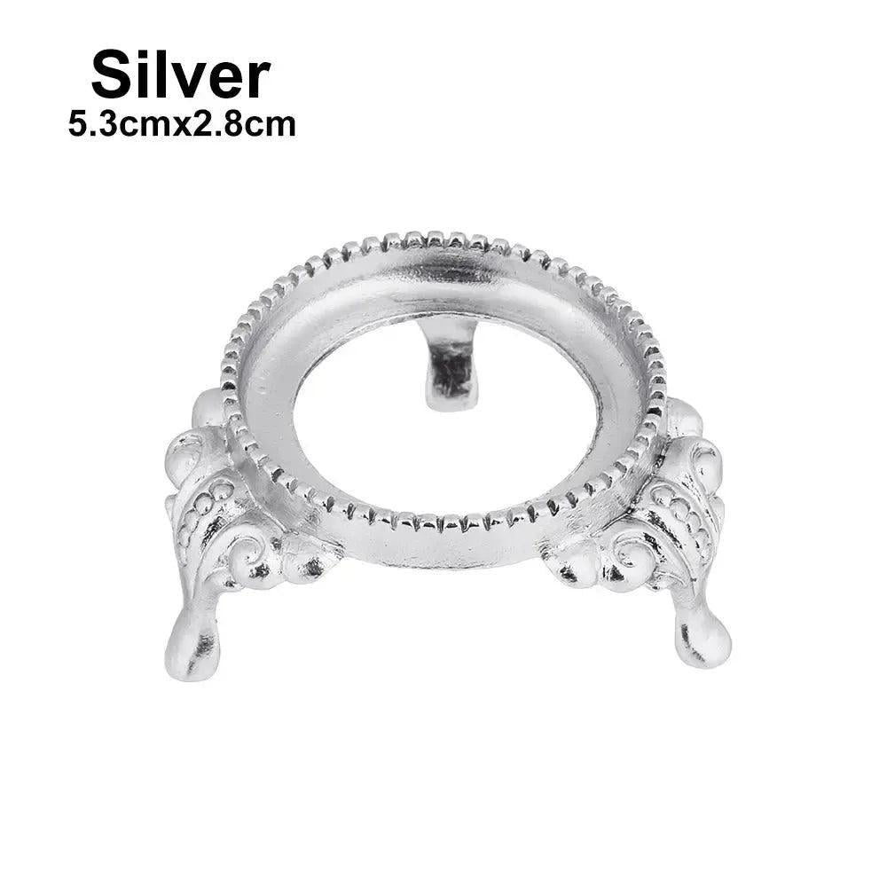Elegant silver metal crystal sphere display stand, 5.3cmx2.8cm, with ornate legs and a decorative rim for gemstones.