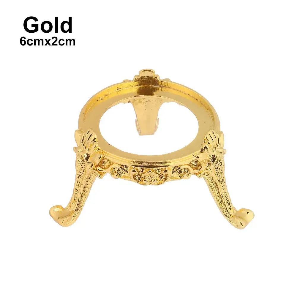 Elegant gold metal sphere display stand, 6cmx2cm, with ornate scrollwork, perfect for showcasing crystal spheres.