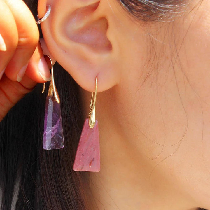 Faceted amethyst and rhodochrosite crystal drop earrings, set in gold, offering intuition and love.