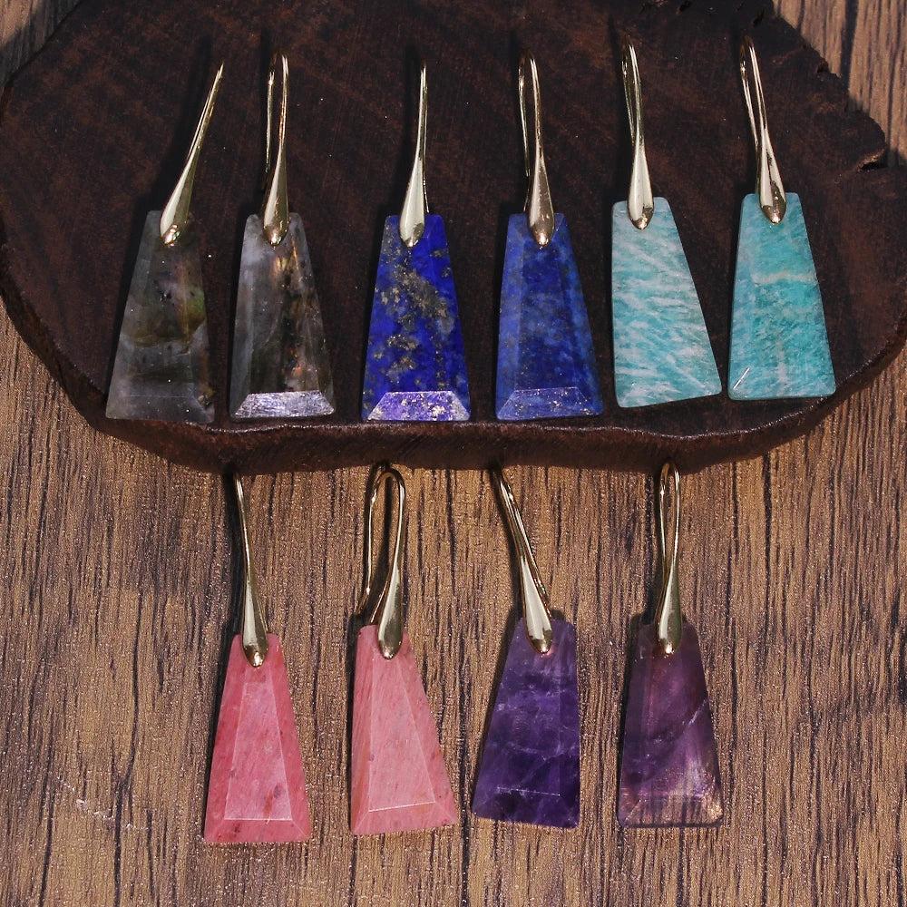 Faceted crystal drop earrings in various colors like amethyst, lapis lazuli, and amazonite, promoting intuition and love.