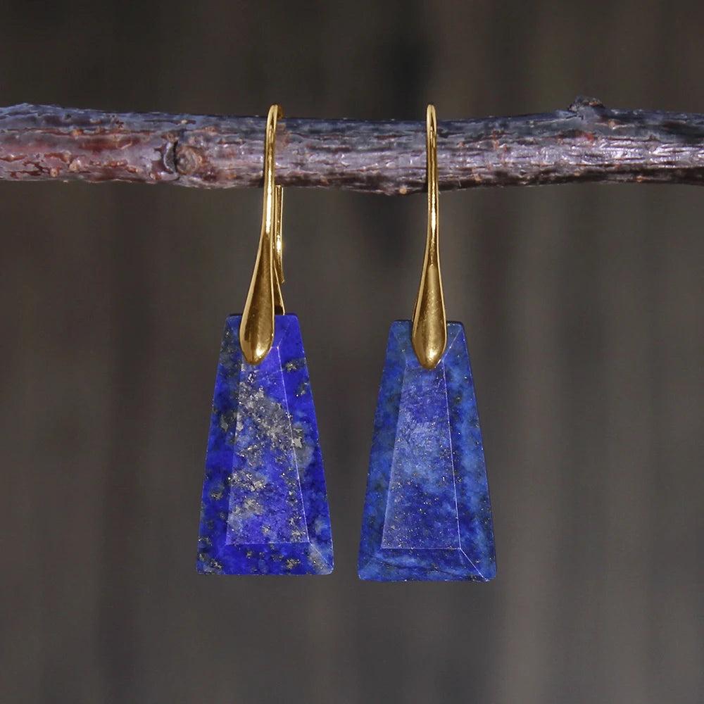 Lapis Lazuli Crystal Stone Faceted Drop Earrings. Deep blue trapezoidal stones with gold hooks for communication and truth.