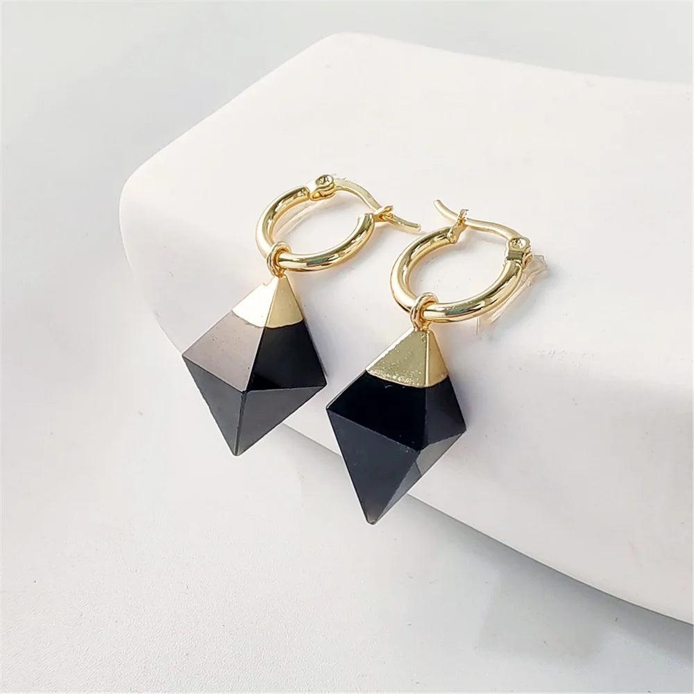 Gold hoop earrings with faceted black obsidian crystal stones for grounding and stability.