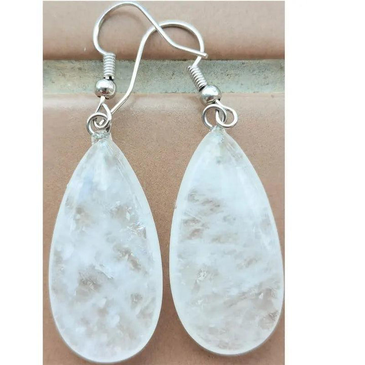 Clear quartz teardrop drop earrings, set in copper wire, for heart-opening and clarity.